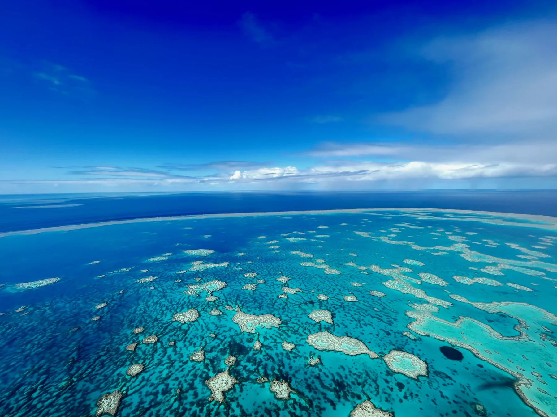 Turquoise reef and islands viewed from above